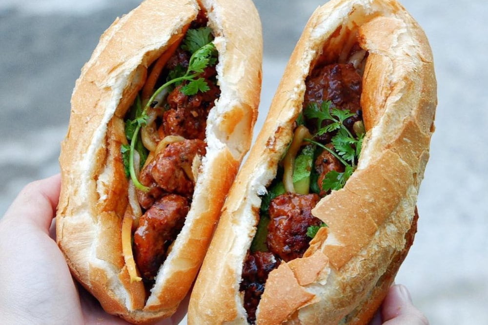 The flavorful, juicy pork meatballs combined with the crispy, fragrant baguette create a perfect banh mi